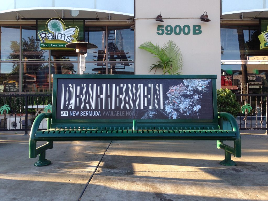 Bus Bench Advertisement in Front of a Store